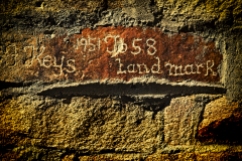 Carved his name in a wall.